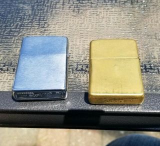 2 Vintage Zippo lighters.  70 ' s GM General Motors and 2010 brass 3