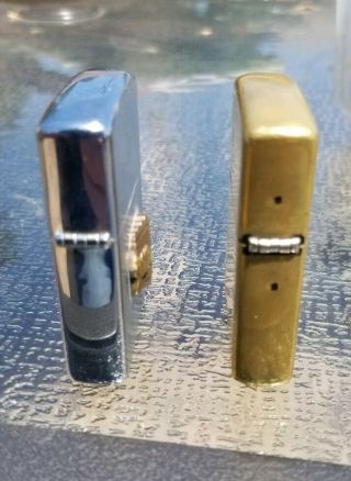 2 Vintage Zippo lighters.  70 ' s GM General Motors and 2010 brass 4