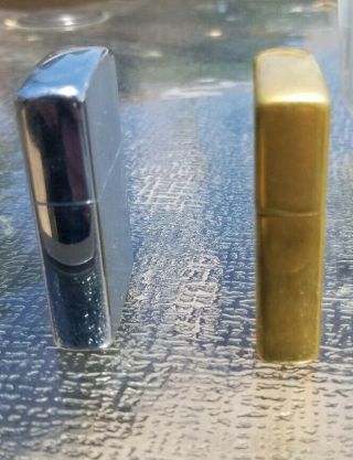 2 Vintage Zippo lighters.  70 ' s GM General Motors and 2010 brass 5