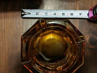 Vintage Amber glass ashtray.  heavy.  Octagon - 4 cigarette placings 3
