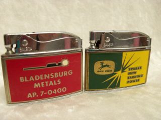 2 Vintage Wellington Balboa Advertising Lighters John Deere & Bladesburg Metals