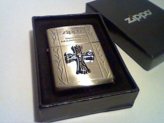 An Zippo Lighter Still In Its Box With Papers.