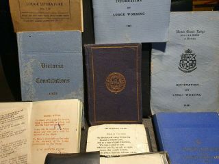 A medal and assortment of Freemason Masonic books and booklets 4