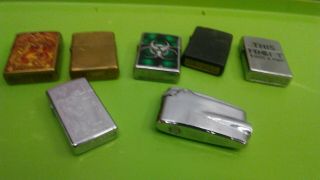 6 Zippo lighters and one Ronson 2