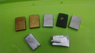 6 Zippo lighters and one Ronson 3