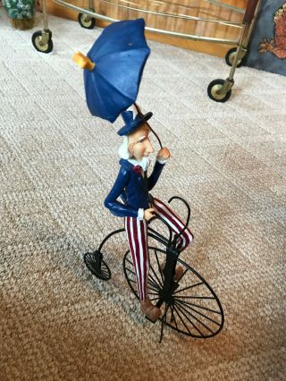 Uncle Sam On A High Wheel Bicycle - Folk Art Resin Sculpture - Comical Fun - 13 "