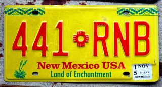 Red Yellow And Green Mexico License Plate With A 1994 Sticker - 2015 Sticker