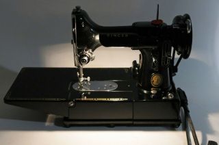 Singer 222k sewing machine with case and attachments.  110v. 11