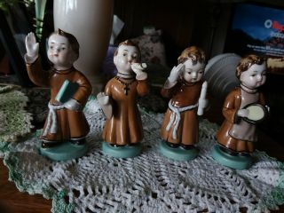 Set Of 4 Vintage Ceramic Christmas Boy Munks Figurines