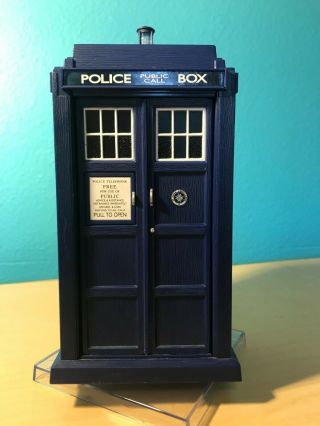 Blue Tardis Model.  Makes Tardis Noise,  Spins And Lights Up.  Doors Open