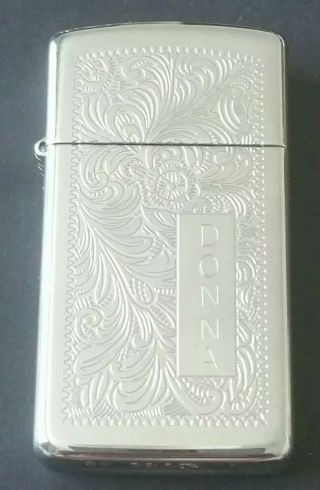 Zippo Lighter: Slim Venetian Polished Chrome.  Engraved Girl 