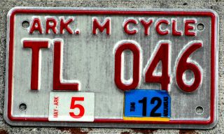 Red On White Arkansas Motorcycle License Plate With A 2012 Sticker