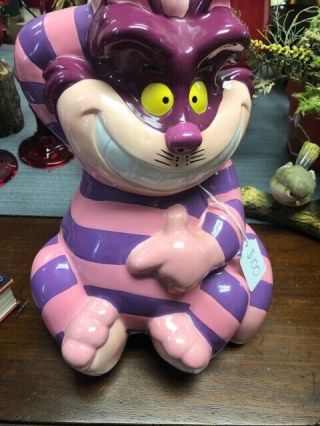 Disney Cheshire Cat Cookie Jar In In Pink And Purple.