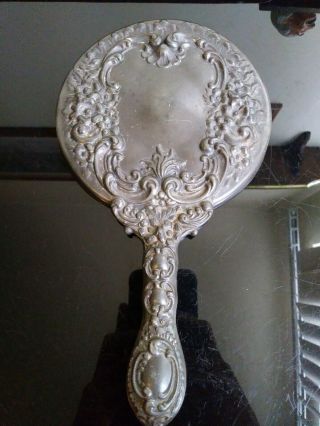 Antique Hand Mirror Beveled Glass And Silver Plated Floral Handle.