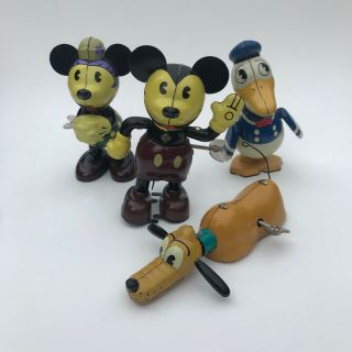 Schylling Wind Up Tin Toys - Disney,  Mickey Mouse,  Pluto,  Donald Duck,  Minnie