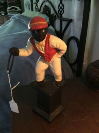 Antique - Black Americana,  cast - iron,  small lawn jockey. 8