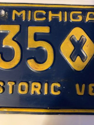 Michigan License Plate - Historic Vehicle.  Yellow Border.  135 - 50.  - Solid. 3