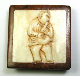 Bb Hand Carved Button Man Playing Saxophone Set In Wood Design - 2 " Diagonally