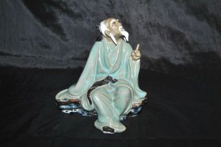 Vintage Chinese Mud Man Sitting On A Rock Pointing Figurine