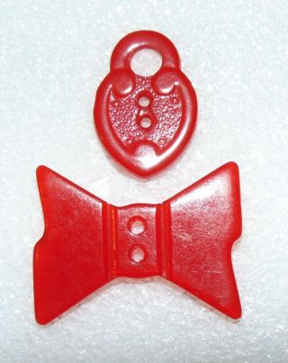 2 Realistic Red Bakelite Lock & Bow Buttons 4426