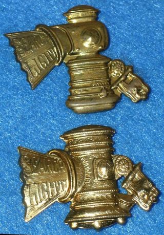 2 Diff Antique SEARCH LIGHT BICYCLE LAMP ADVERTISING PINS Brass CARBIDE LIGHTS 2