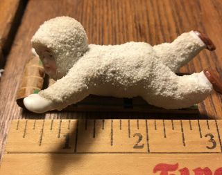 Vintage 3 1/4” Snow Baby On Wooden Sled