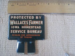 Protected By Wallace ' s Farmer Iowa Homestead Service Bureau License Plate Topper 2