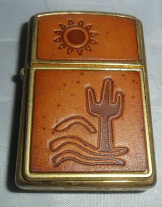 Unfired Zippo Lighter,  Dated 2004 Leather & Brass Sun & Cactus