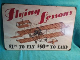 " Flying Lessons " - Vintage Metal Sign With Eyelets - Ande Rooney Aviation Signs
