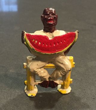 Antique Cast Iron Black Americana Figurine Sitting On Fence Eating Watermelon