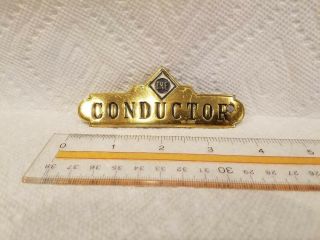 Erie Railroad Conductors Hat Badge.  Brass With Erie Herald