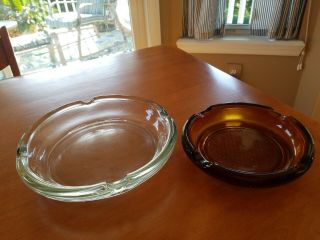 2 Vintage Heavy Glass Ashtrays 7 3/4 " Clear And 5 3/4 " Amber