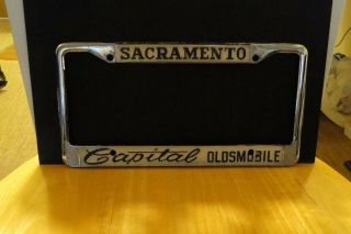 Vintage Sacramento Capitol Oldsmobile Dealership License Plate Frame Metal