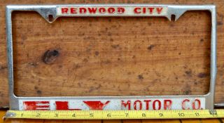 Vtg 60s Embossed Metal Dealer License Plate Frame Ely Motors Redwood City Ca