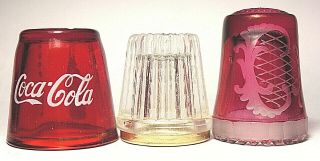 Three (3) Glass Thimbles - Coca Cola,  Cut Glass And Cranberry Glass