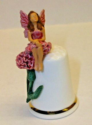 A Bone China Flower Fairy Thimble Sitting On A Pink Flower Stamped E.  K.  M.