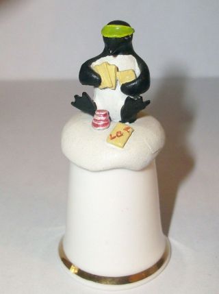 A Bone China Thimble With A Cute Pewter - - Card Playing Penguin - - On Top
