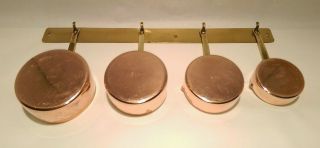 Set Of 4 Heavy Vintage Copper Measuring Cups With Brass Handles And Rack