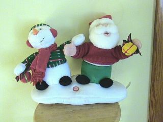 Santa With Snowman Singing " We Wish You A Merry Christmas ".  Santa Sings & Dances