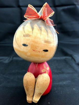 4.  7 Inch Cute Japanese Creative Wooden Sitting Girl Kokeshi Doll Red Ribbon