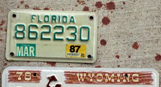 Green on White Florida MOTORCYCLE License Plate with a 1987 Sticker 2