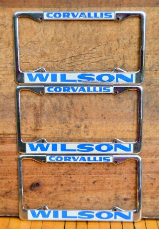 Set 3 Vtg Metal Dealer License Plate Frames Wilson Corvallis Oregon Sticker