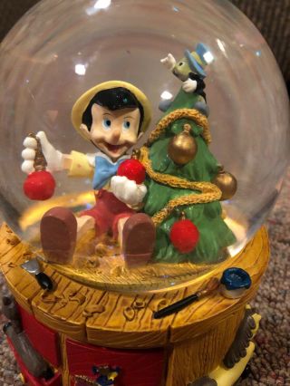 Disney Pinocchio Christmas Snow Globe Music Box Deck the Halls by Enesco 2