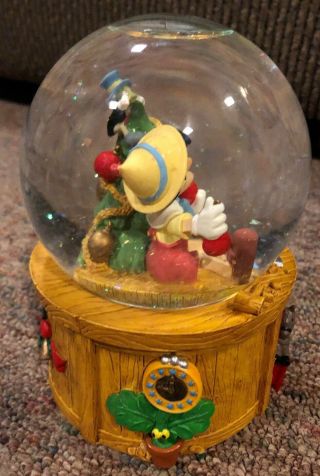 Disney Pinocchio Christmas Snow Globe Music Box Deck the Halls by Enesco 5