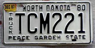 1980 Black On White North Dakota Truck License Plate With A 1987 Sticker