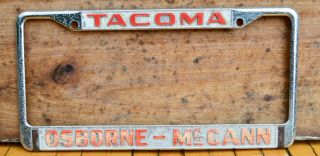 Vtg 60s Embossed Metal Dealer License Plate Frame Osborne Mccann Cadillac Tacoma