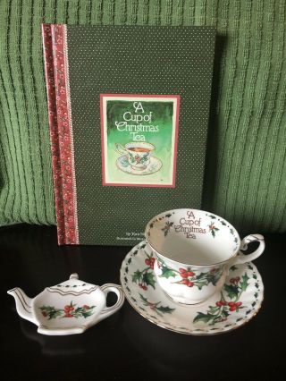 A Cup Of Christmas Tea Cup And Saucer With Teabag Holder And Book