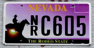 Nevada " The Rodeo State " License Plate With A Cowboy On A Horse At Sunrise