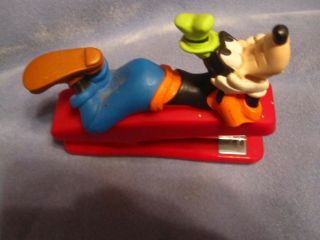Goofy Laying Down On Top Of Red Stapler Walt Disney Mickey Mouse And Friends