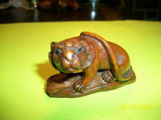 Antique Hand Carved And Signed,  Brown,  Boxwood Netsuke Of Lion On Log.